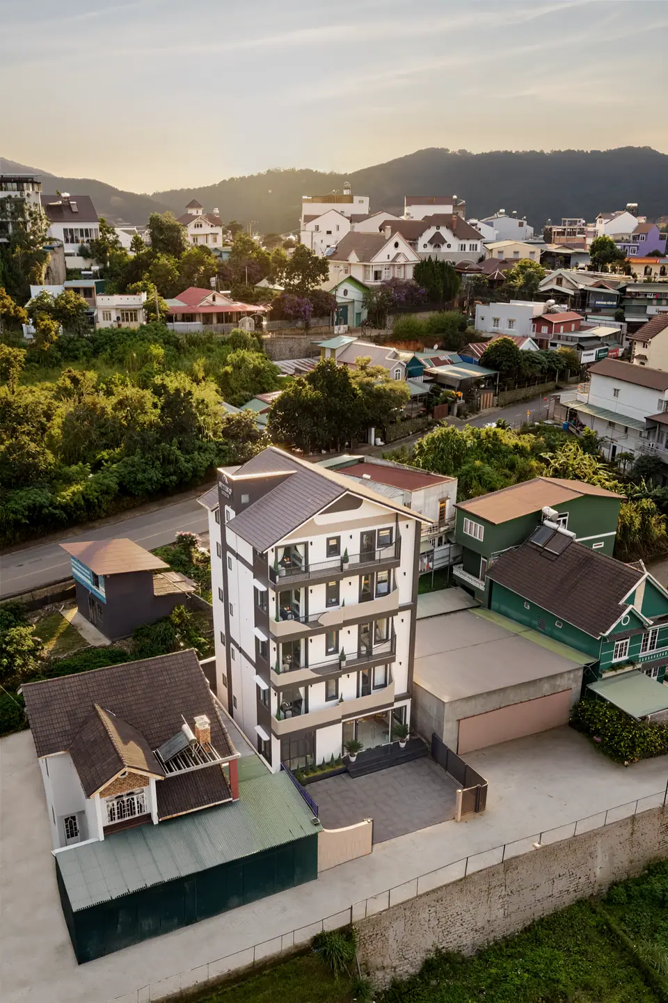 OTTIMO from above, on a quiet hillside with Da Lat and the mountains behind