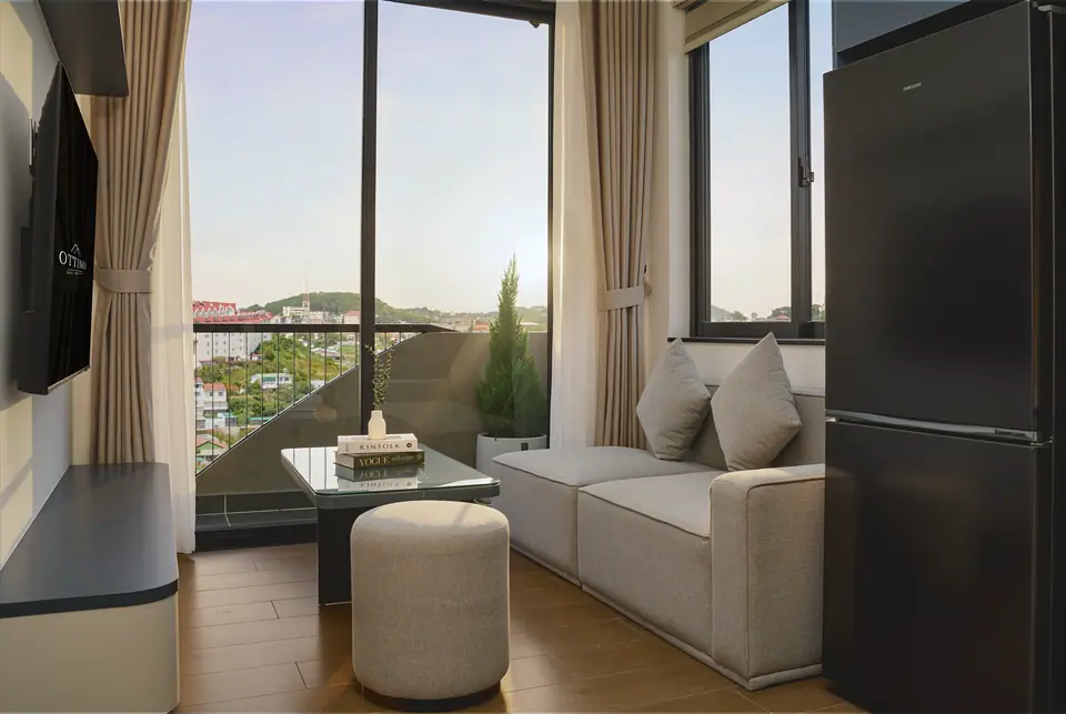 Living room with a sofa beside the balcony