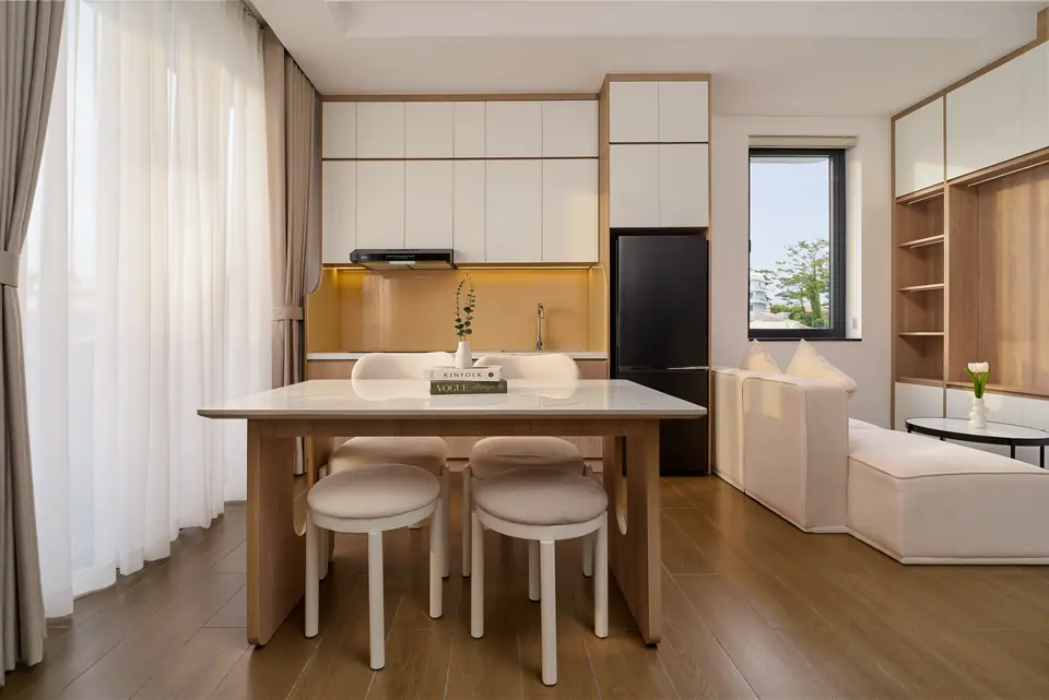 Open living, kitchen and dining space with a table for four